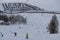 People sking snowboarding down the slope. Town of Livigno in winter. Livigno landscapes in Lombardy, Italy, located in the Italian