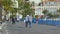 People slowly strolling along Walkway of English, enjoying delightful sea view