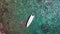 People snorkeling in tropical sea near yacht. Aerial view