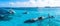 People snorkelling around the ship wreck near Cancun in the Caribbean sea.