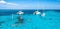 People snorkelling around the ship wreck near Cancun in the Caribbean sea.