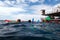 People snorkelling and dive from a platform in the Great Barrier