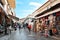 People and souvenirs on the Plaka streets Athens Greece