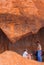 People in a spectacular cave in Ayers Rock(Unesco),Australia