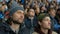 People spectator fan watch game hockey closeup excitedly look match in crowd 4K.