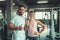 People sport couple concept in fitness gym are giving thumbs up for symbol good health., Portrait of couple in sportswear are