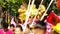 People spray holy water to the Buddha statue in parade