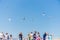 People stand on the ferry and watch the seagulls blue sky background