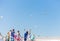 People stand on the ferry and watch the seagulls blue sky background