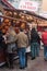 People standing at the christmas market in front of Mulled wine cabin, traduction of vin chaud in french