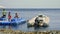 People standing on floating jetty at coral reef