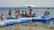 People standing on floating jetty at coral reef