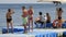 People standing on floating jetty at coral reef