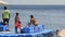 People standing on floating jetty at coral reef