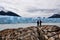 People standing in front of the Perito Moreno glacier