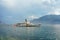 People standup paddle surfing and excursion ferry Vevey Swiss Riviera