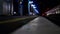 People at the station waiting for the train. A restless man walks on the platform. Passengers at the railway station near the rail