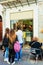 People staying in a queue at the gelateria ice cream store in Monreale old city center, Sicily, Italy