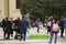 People on the street near Berlin concert hall, tourist scene, Soap bubbles and people take photos and videos in the street