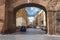 People on street Via del Mascherino in Rome. Gate in the wall, e