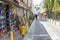 People stroll down brick paved alley lined with colorful graffiti in Belleville, Paris, France