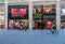 People stroll on Paradise Street around the Liverpool ONE shopping district in Liverpool as a cyclist passes by