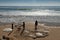 people strolling on the carcavelos beach with surfers and boat