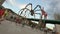 People strolling near Maman spider and La Salve Bridge, modern sculpture art