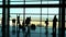 People with suitcases in the airport waiting room. silhouette anonymous passengers. silhouette traveling through vietnam