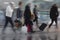 People with suitcases in blurred motion at airport