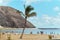 People sunbath on sandy picturesque cozy beach of Playa de Las Teresitas