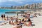 People sunbathing on the beach of El Arenal resort town, Majorca, Baleares, Spain