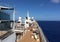 People Sunbathing on the Deck of a Cruise Ship Traveling at Sea