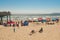 People sunbathing on Pismo beach in a bright sunny day