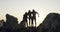 People, sunset and hiking silhouette on mountain in nature, view and outdoor in travel and climbing adventure. Friends