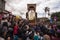 People surrounding a religious float during the Easter procession