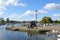 People and swans at historic harbour