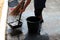 People are sweeping dirty water at ground streets, cleaner floor, housemaid, housekeeper, homemaker, maidservant, maid