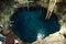 People swim in a cenote