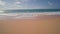 People swim in the ocean. Yellow sand at Sandy Beach on the tropical island of Oahu Hawaii. The turquoise color of the