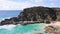 People swim in the turquoise waters of the Tropical Beach. Halona Beach Cove. Blue Waves of the Pacific Ocean Beats Oahu