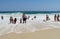 People swiming in the ocean waves at Copacabana beach