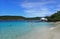 People swimming in the ocean at Coki Beach US Virgin Islands on a bright November day