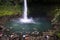 People swimming at the pool of the La Fortuna Waterfall in Costa Rica.