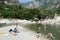 People swimming and sunbathing on maggia river at Ponte Brolla