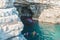 people swimming to grotto cave in sea famous landmark