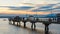 People take a late winter evening walk on the fishing pier at Edmonds Washington