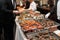 People Taking Food in Buffet Catering Dining Eating Party. Event Buffet Concept