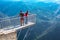 People taking photo at panoramic mountain viewpoint Eagle eye, Orlovo Oko in Rhodope