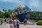 People taking photos next to Universal sphere at Universal Studios area 1